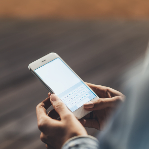 Close up of a woman holding a smartphone