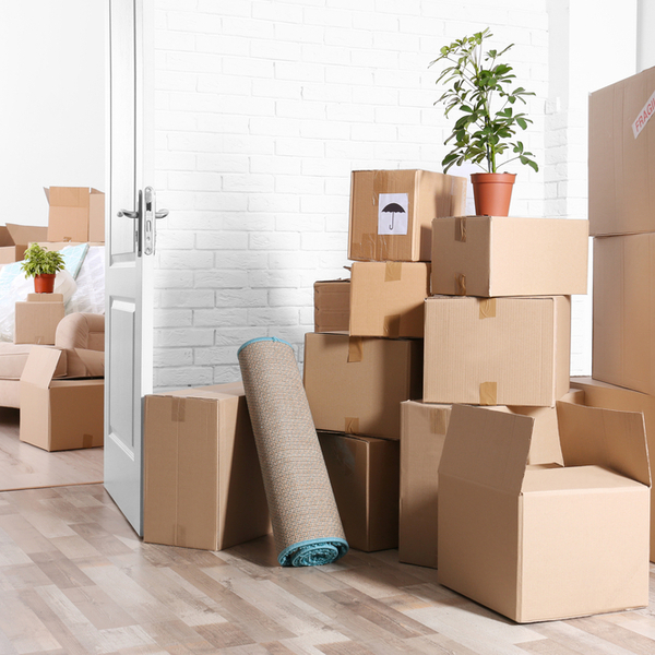 A pile of boxes in an empty room