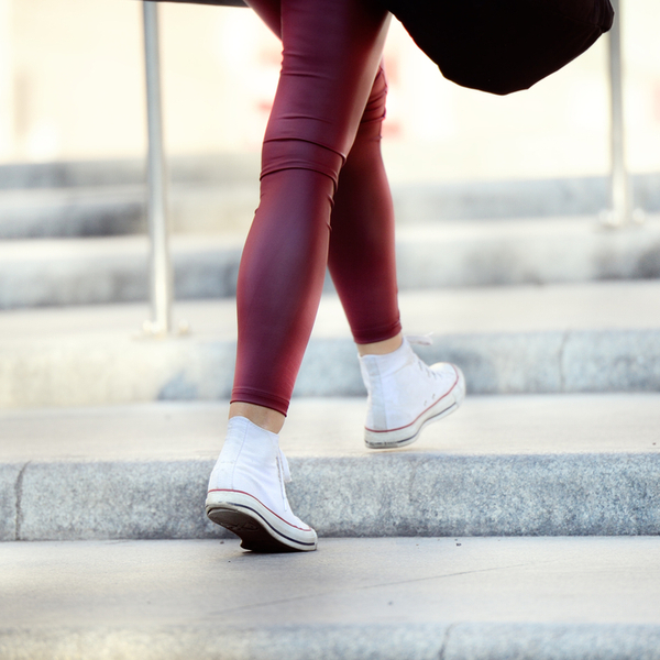 Close up of woman walking up stairs