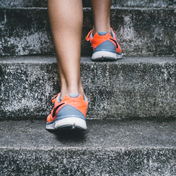 Close-up of someone walking up some steps