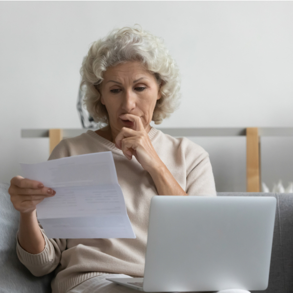 A woman looking at some paperwork.