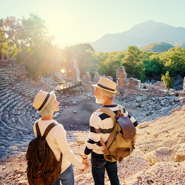 A mature couple visiting an ancient amphitheatre.