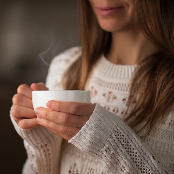 A woman relaxing with a cup of tea.