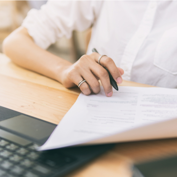 A woman going through some paperwork.