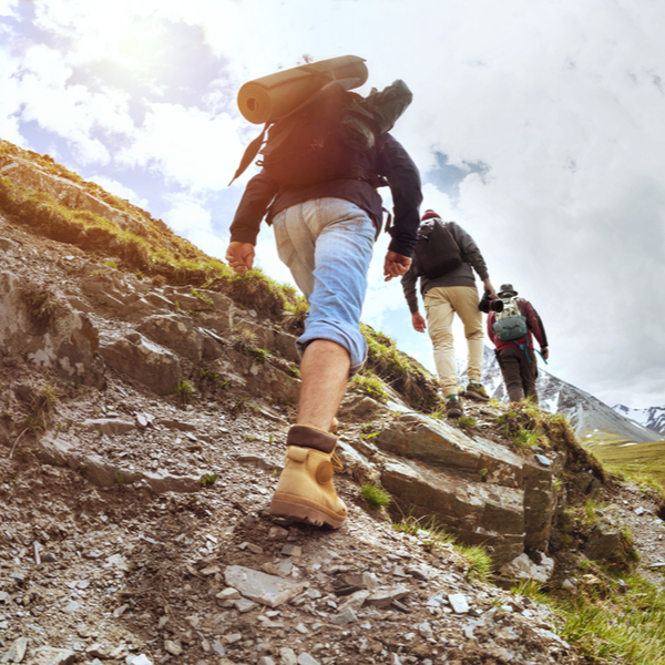 Hikers walking up a hill.