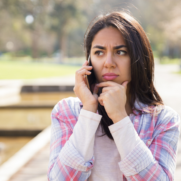 Lady looking concerned about a phone call