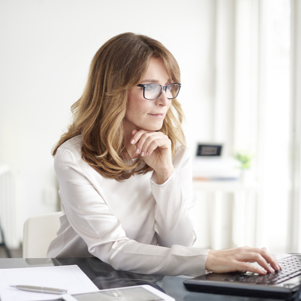 A businesswoman working on a computer.