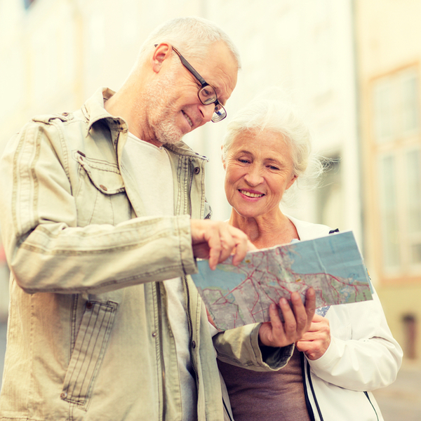 A couple looking at a map while on holiday.