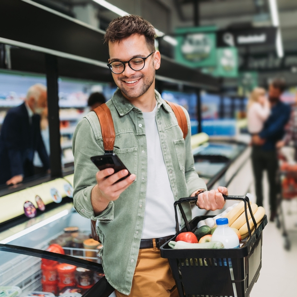 A man shopping in a supermarket.