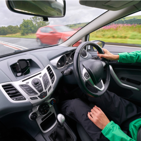 A person driving down a road.