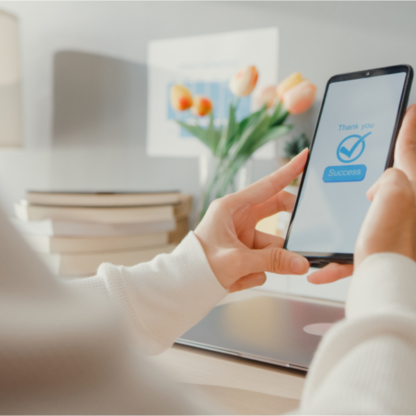 A woman using her phone for online banking.