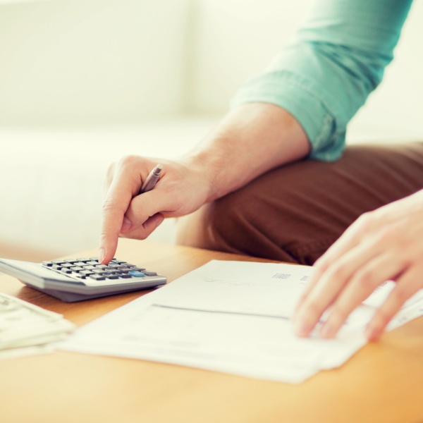 A man using a calculator.