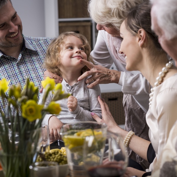 Multi-generation family having dinner together.