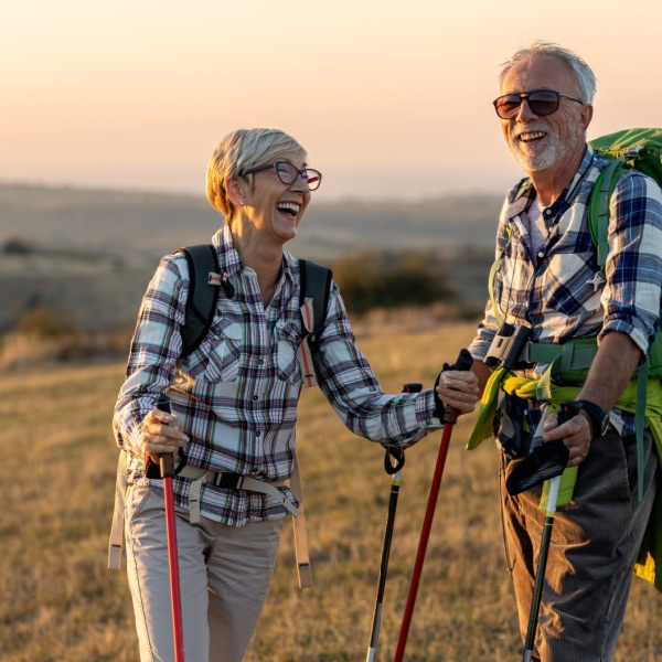 A retired couple hiking.