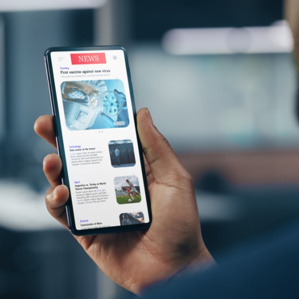 A man checking the news on his smartphone.