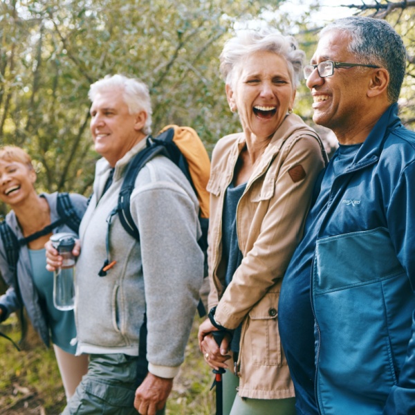 A group of friends hiking and laughing together.