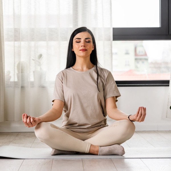 A woman meditating.