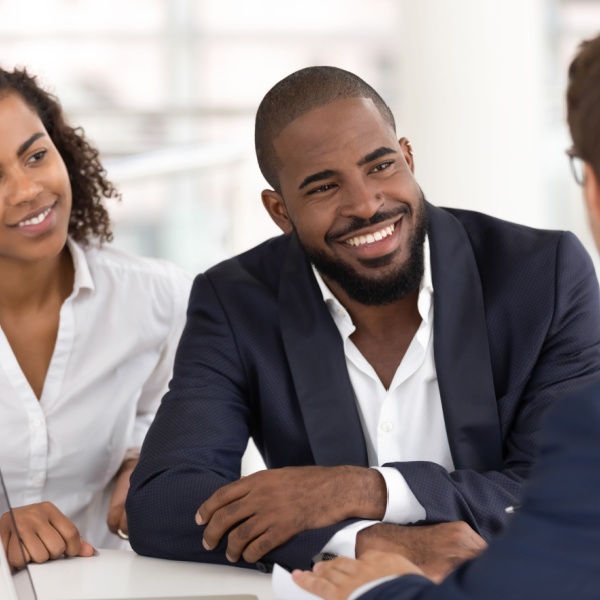 A couple taking to a financial planner.