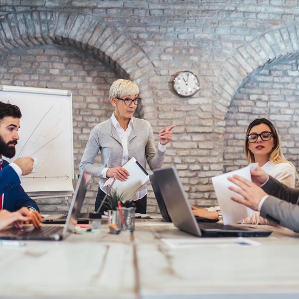 A group of colleagues sitting around a conference table.
