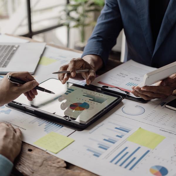 Business people looking at documents in an office.