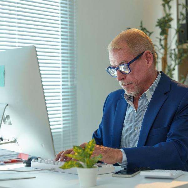 A man working at an office desk.