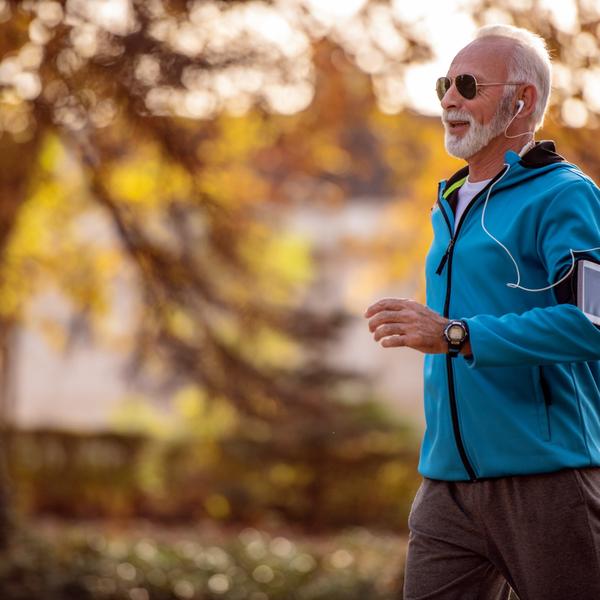 A man jogging in a park.