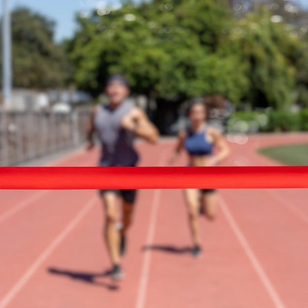 Runners running towards a finish line.