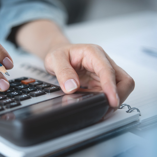 A person using a calculator.