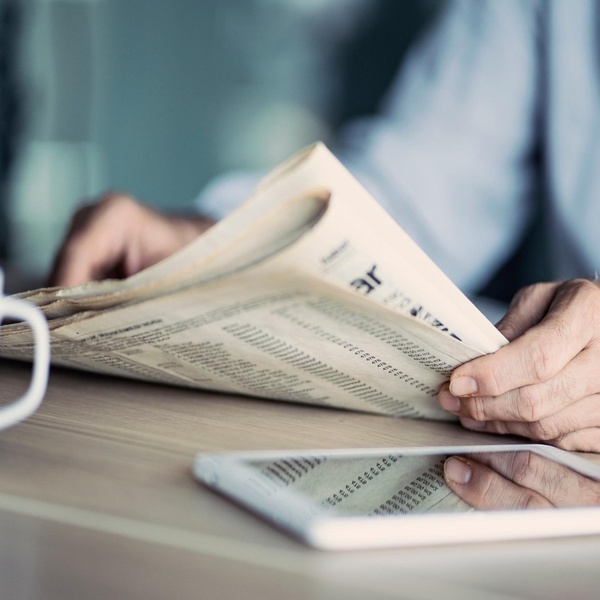 A man reading a newspaper.