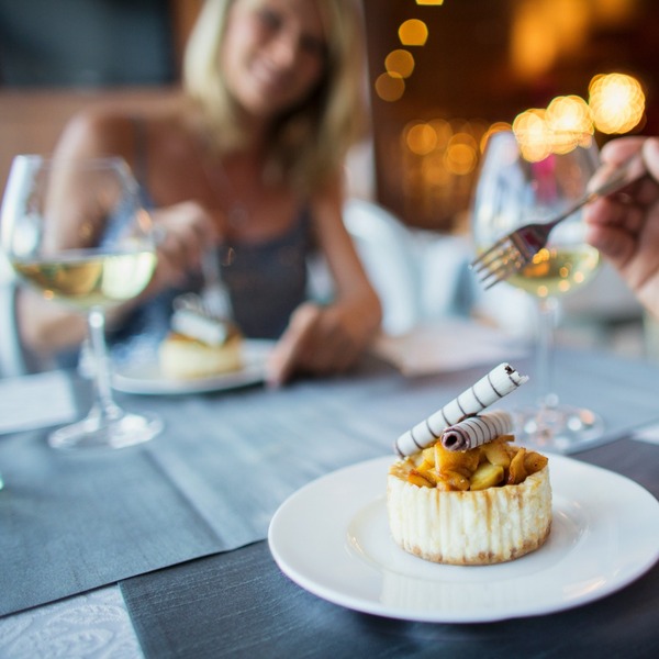 A couple enjoying a meal in a restaurant.