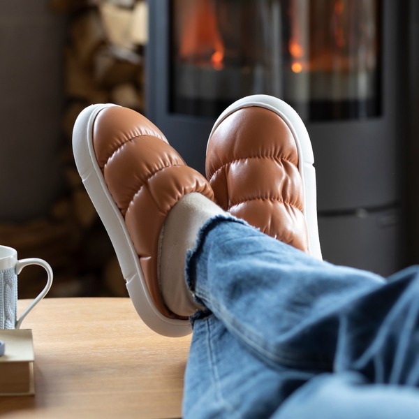 A person sitting with their feet up.