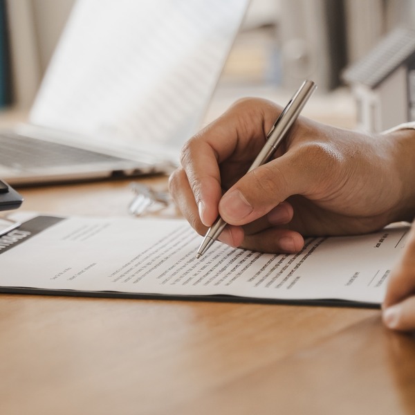 A man checking paperwork.
