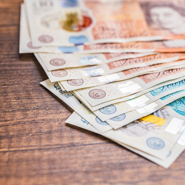 UK bank notes on a table.