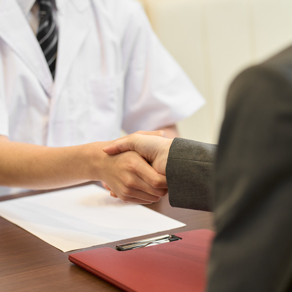 Two people shaking hands.