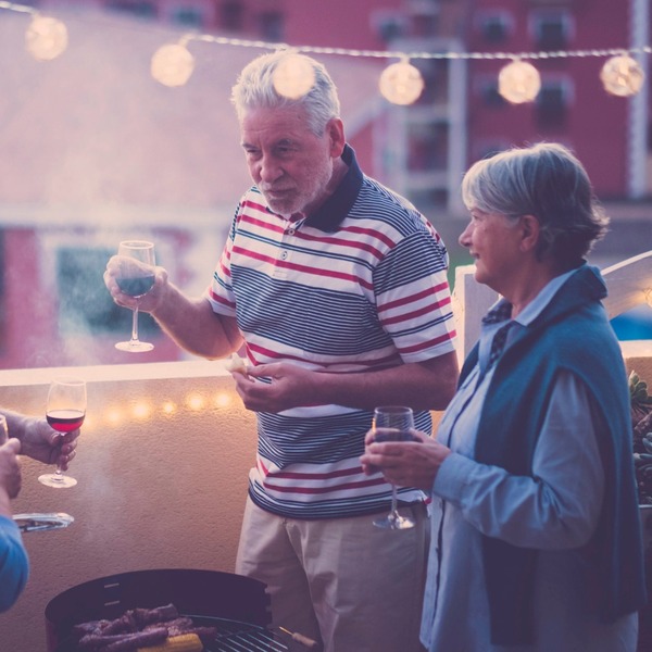 A group of people taking and drinking wine.